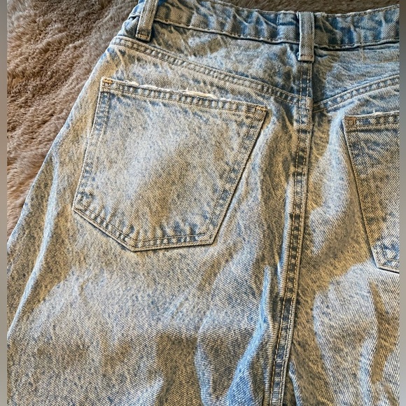 Mom  styled blue jeans distressed look at both the belt and cuffs. - Picture 2 of 3